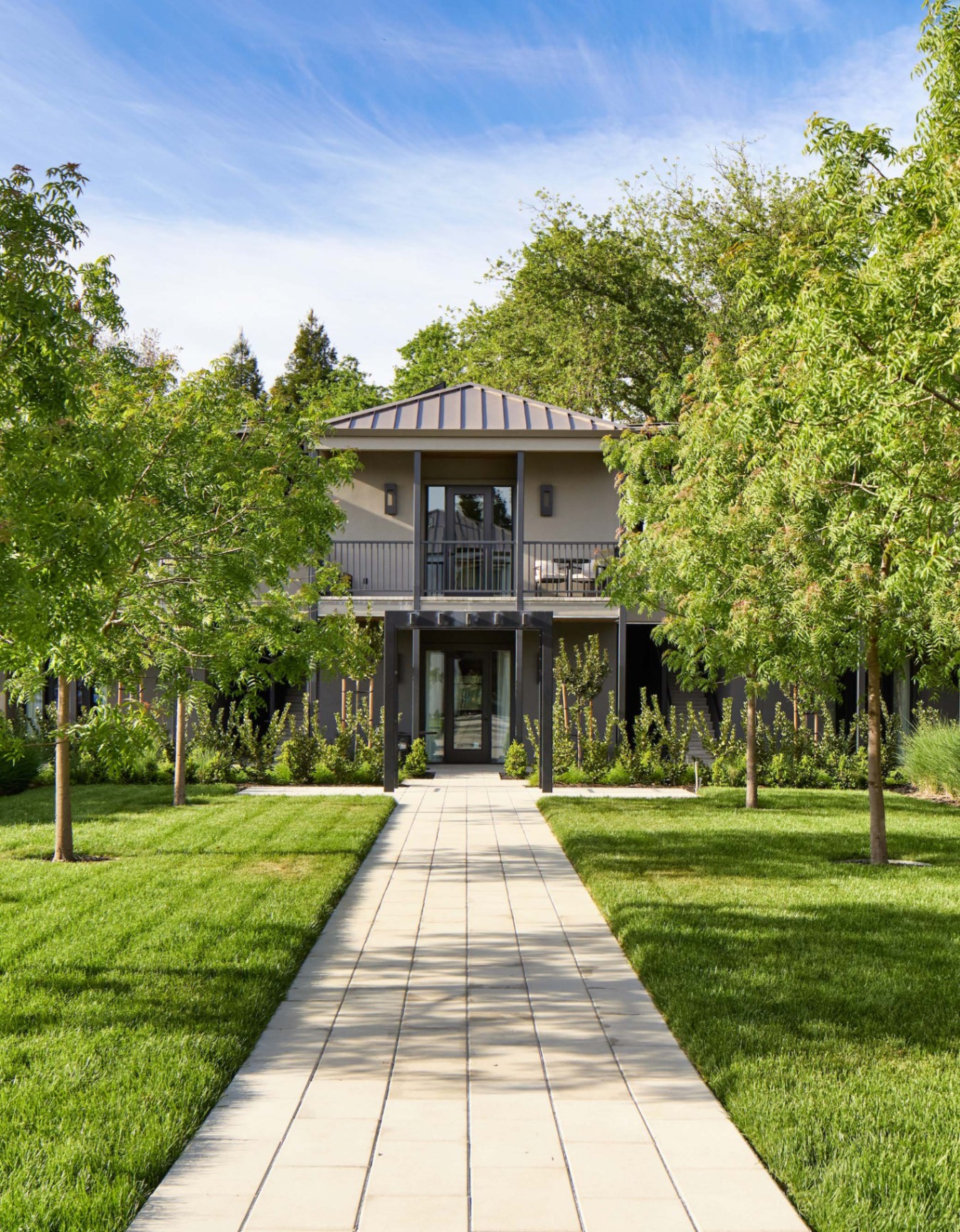 Tree-lined walkway approaching The Grove at Duchamp Healdsburg.